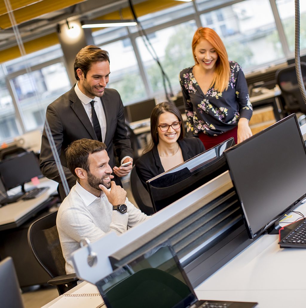 Group of young business people are working together with desktop computer in the office